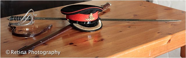 British Army Officers Hat And Ceremonial Sword Ceremonial Sword and Cap on Pine Table
