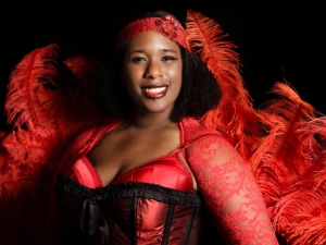 Burlesque Performer In Bright Red Feather Outfit