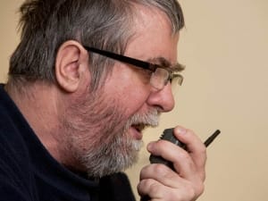 amateur radio ham talking on base station