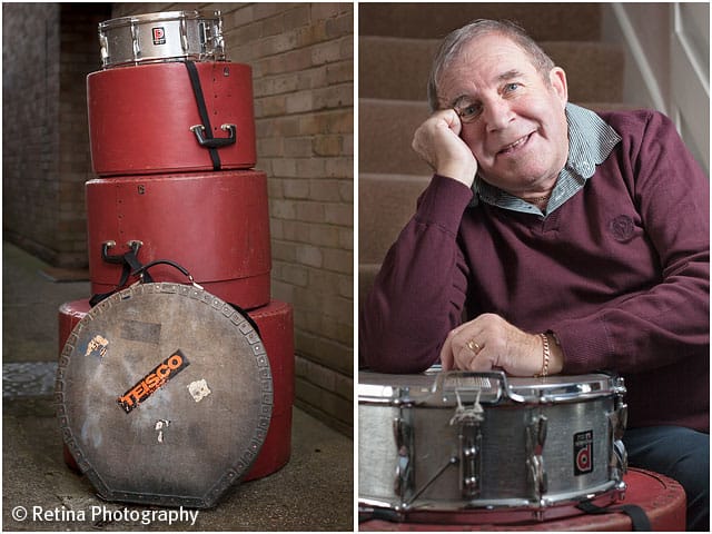 Portrait of Drummer With Stacked Drum Kit in Cases