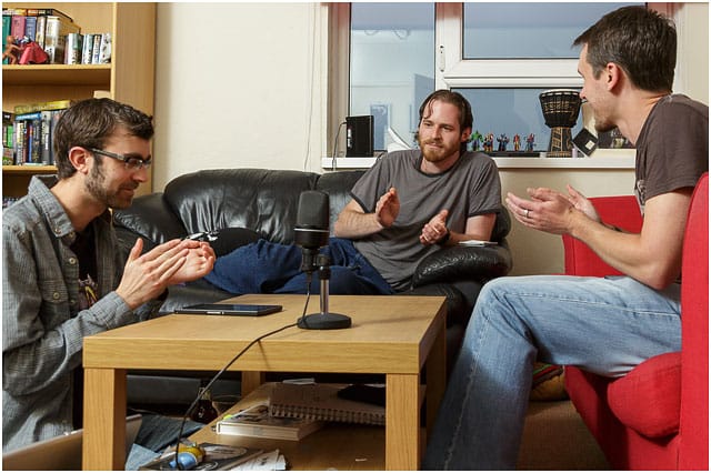 Three Members Of SDFF Podcast Crew Applauding During Recording Session