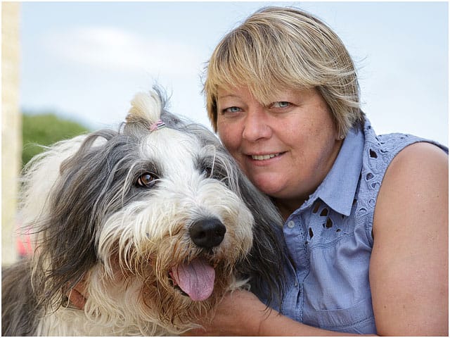 Female Beach Swimmer With Bearded Collie Pet Dog