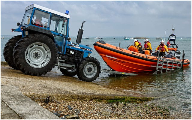 Portsmouth Rnli B Class Atlantic 85 Inshore Rescue Boat Entering The Water By Trailer