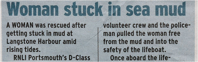 Woman Stuck In Mud Newspaper Clipping