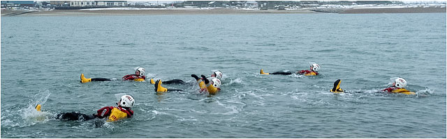 RNLI Volunteer Crew Testing Survival Kit In Cold Water
