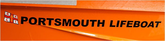 Portsmouth Lifeboat Lettering With Flag On Side Of Inshore Rescue Boat