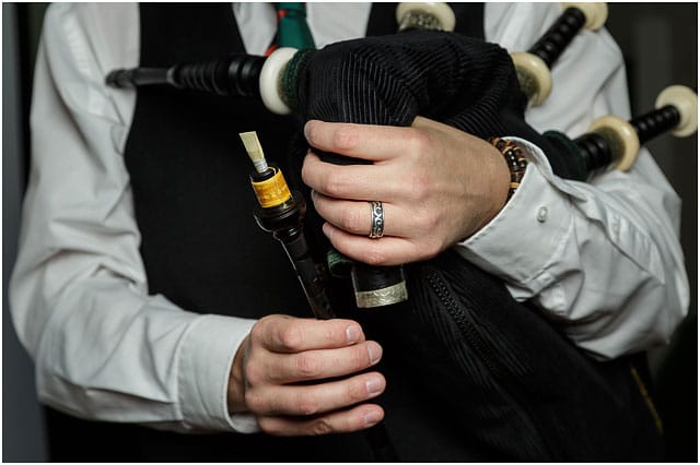 Bagpipes chanter reed held by bagpipe player