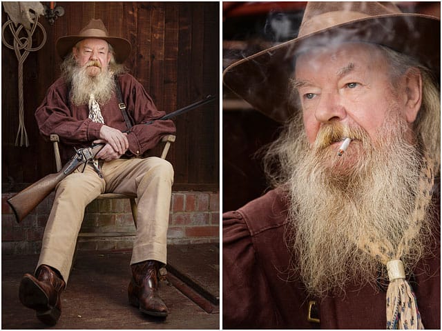 Portrait Of Wild West Role Player Sat In Rocking Chair And Smoking A Cigarette