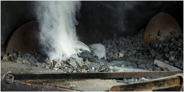 Blacksmiths forge starting up and smoking Blacksmiths Forge Starting Up And Smoking