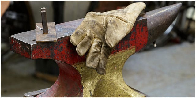 Blacksmiths Glove Laying On Brightly Coloured Anvil