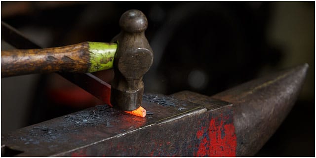 Hot Metal Being Shaped On A Blacksmiths Anvil