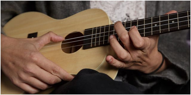 Close Up Of Finger Positions On Ukulele