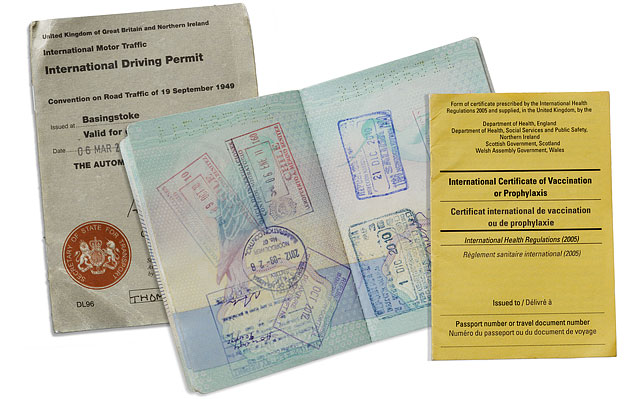 Stamped British Passport International Driving Permit And Vaccination Certificate