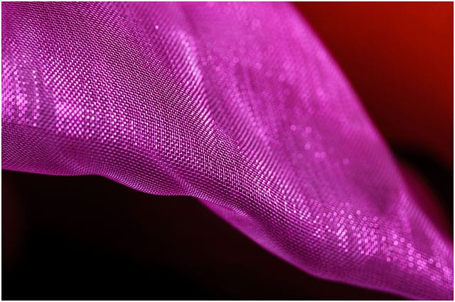 Close up of sheer pink organza fabric 