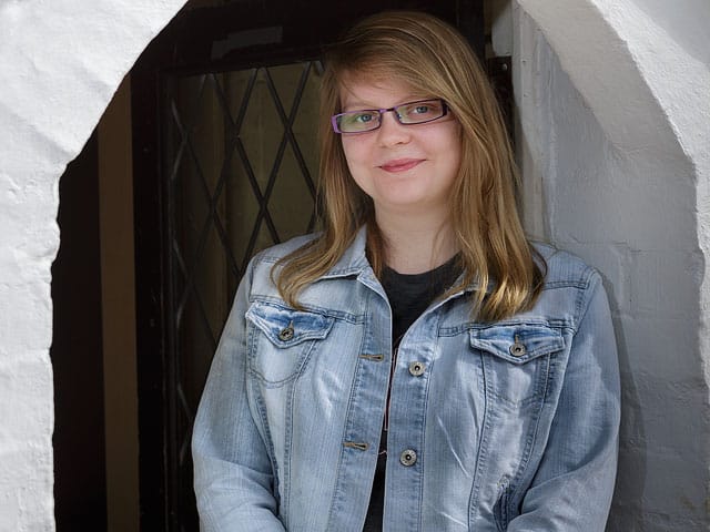 portrait young woman glasses doorway denmead fox hounds public house 