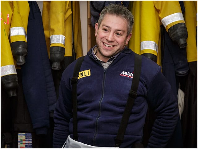 portrait-of-rnli-volunteer-wearing-wooly-bear 'Woolly Bear' under garment - essential for heat retention