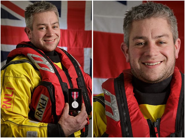 portsmouth-rnli-volunteer-with-queens-jubilee-medal Portsmouth RNLI Volunteer With Queens Jubilee Medal with White Ensign Flag in Background