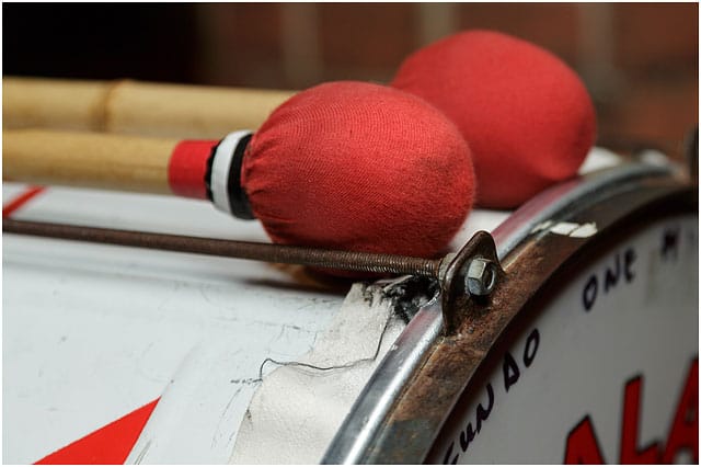 Close up of Portsmouth Batala drumsticks resting on Fundo drum Fundo Portsmouth Batala Drum Drumsticks