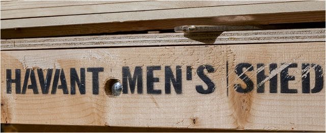 Havant Men’s Shed name stencilled on a wooden bench 