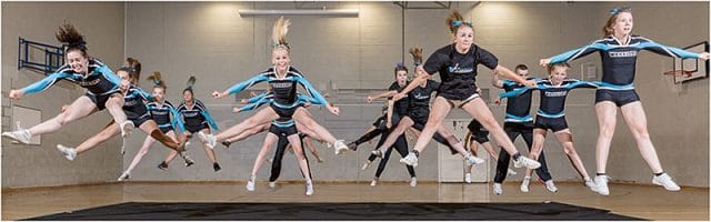 portsmouth warriors cheerleaders practising a synchronised jump 