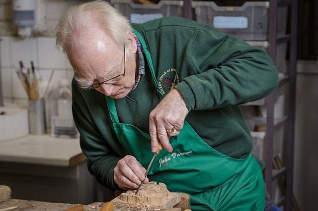 John Vardon secretary of the solent guild of woodcarvers and sculptors at a carve-in day 