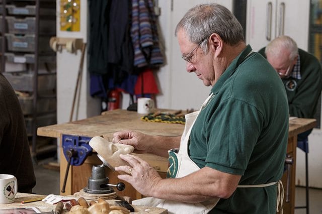 woodcarver at work during a solent woodcarver and sculptors guild carve-in 