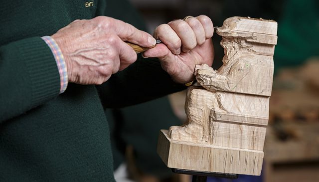 solent woodcarver carving a figurine 