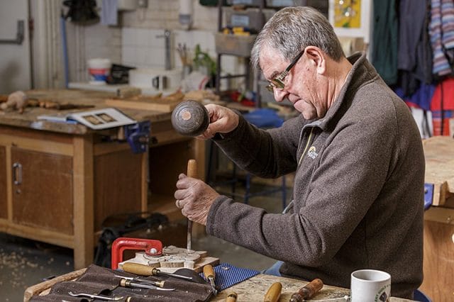 Member of the solent guild fo woodcarvers and sculptors at a carve-in day 