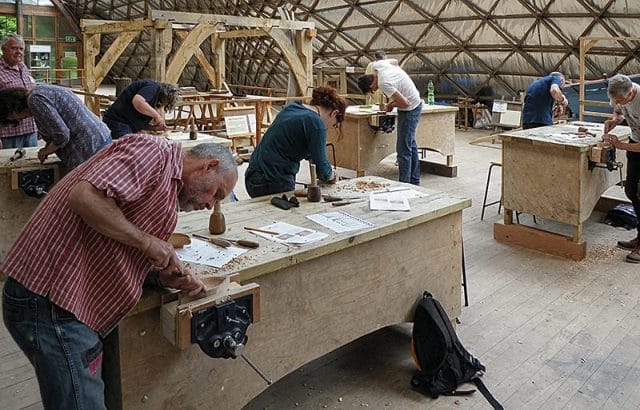 woodcarvers during demonstration day at weald and downland museum 