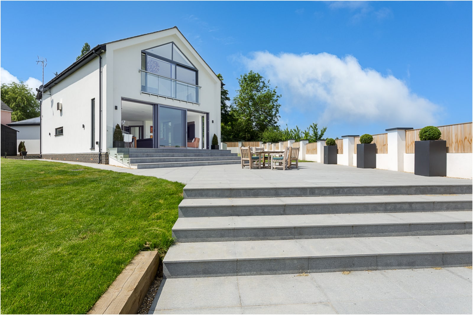 rear garden external view with extended steps towards house of a residential property