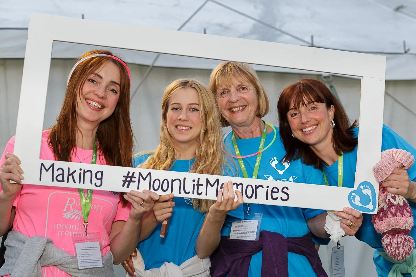 Four female participants in a charity walk posing for a promotional portrait