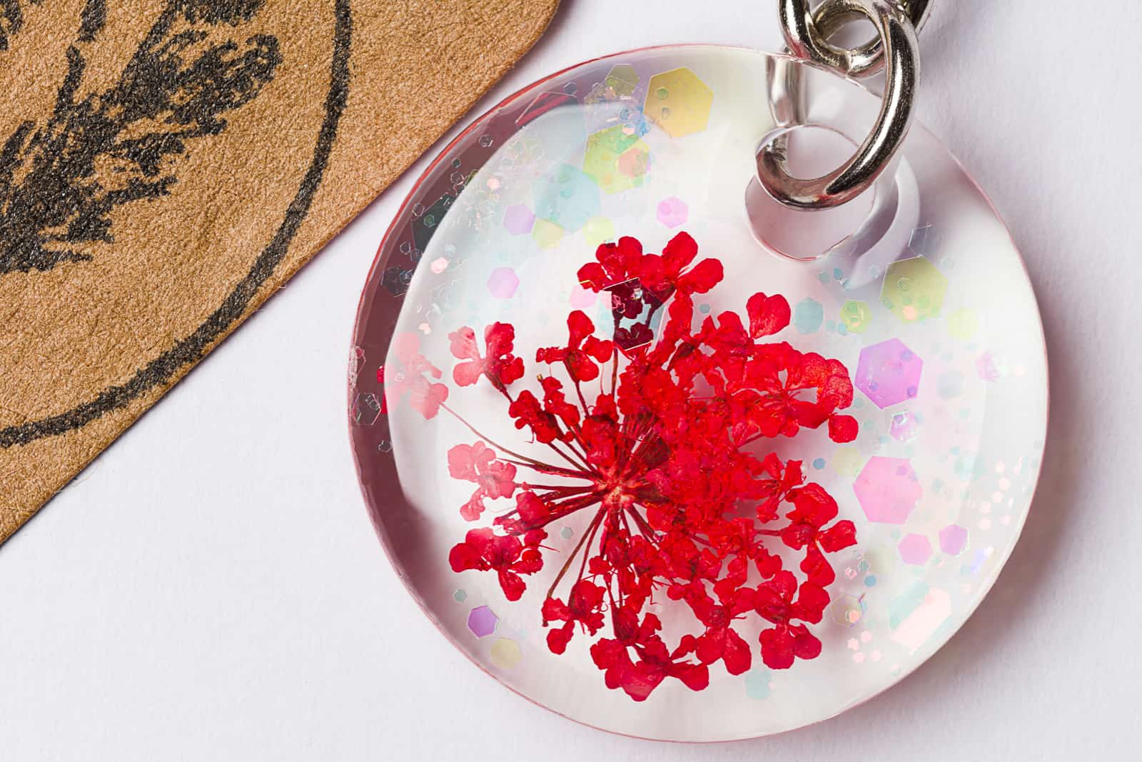 close up of petals set in resin key fob