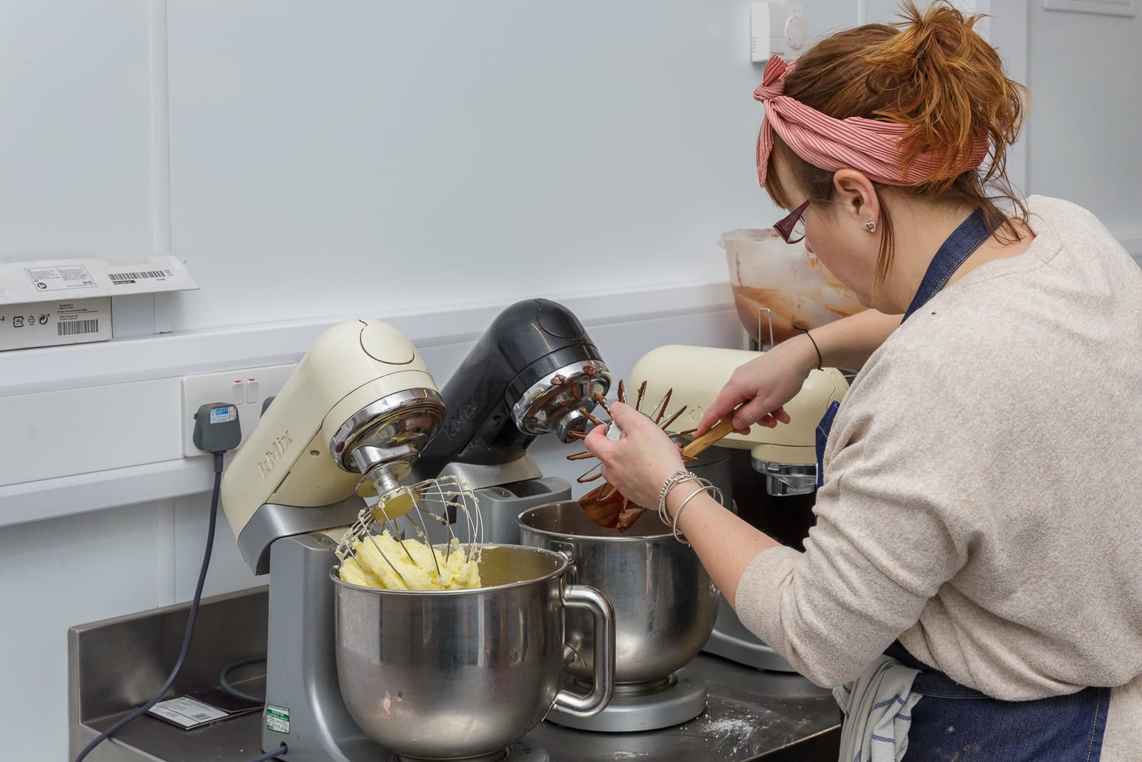 wild tea bar owner working with cake mixers in the barn