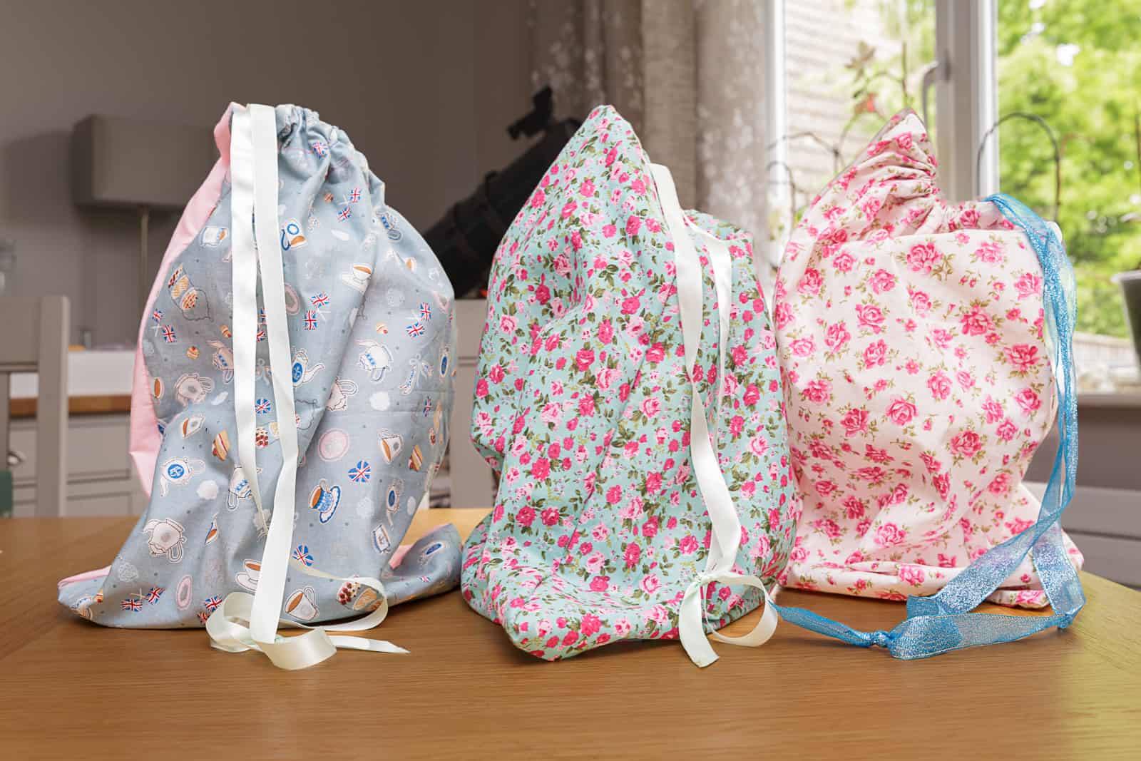 cake-stand-bags_SPL three handmade cloth cake stand bags on a table
