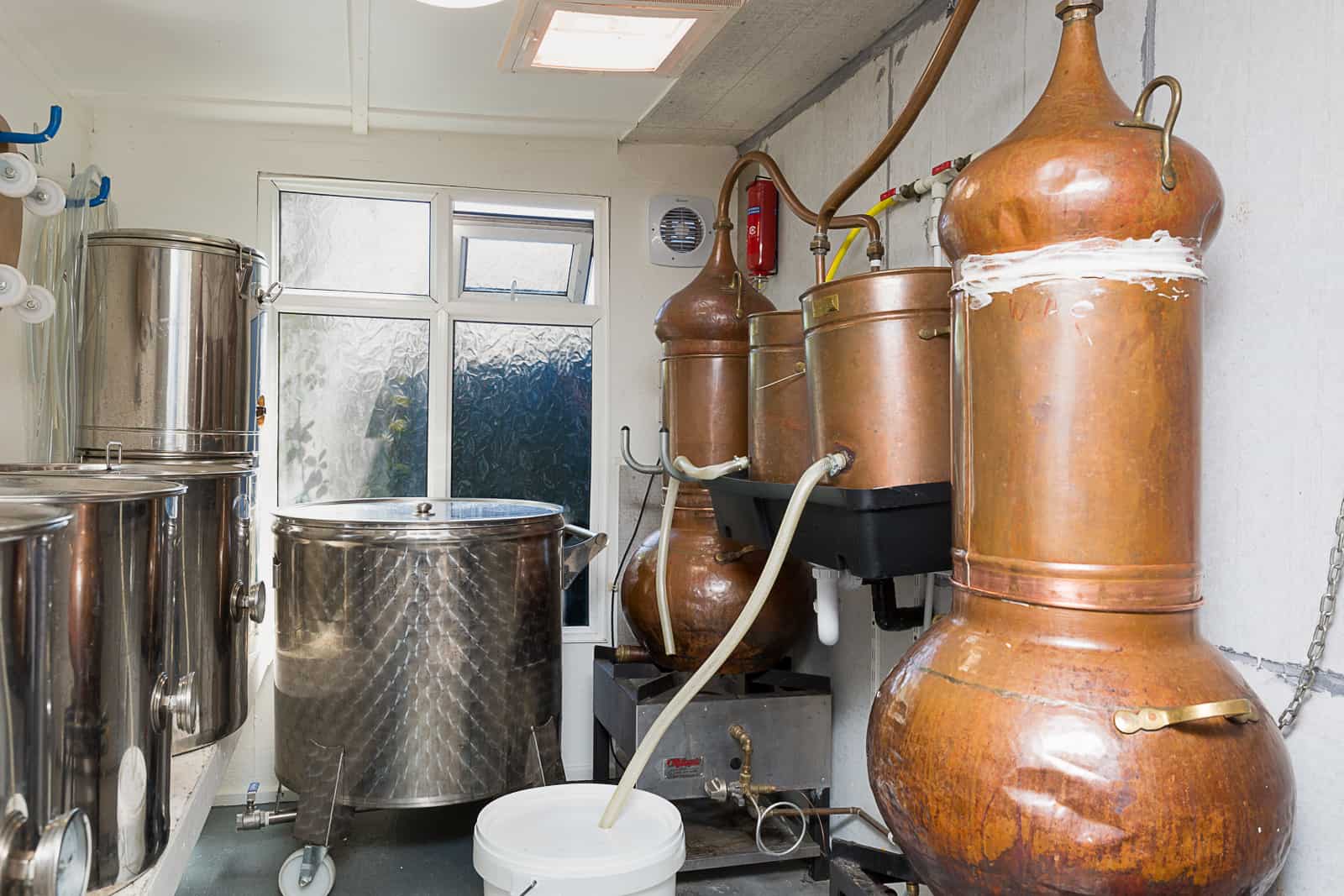 copper stills from Portugal for making gin in the corner fifty three gin distillery