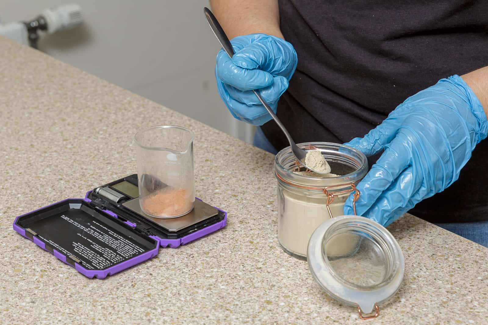 measuring and mixing two different clays for making soap