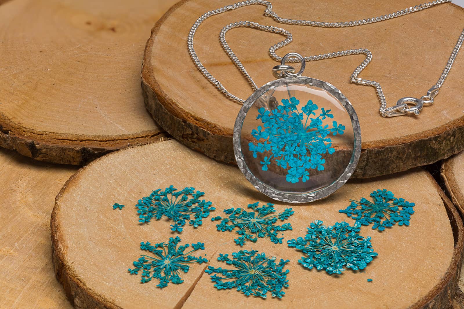 Necklace with flower petals set in resin