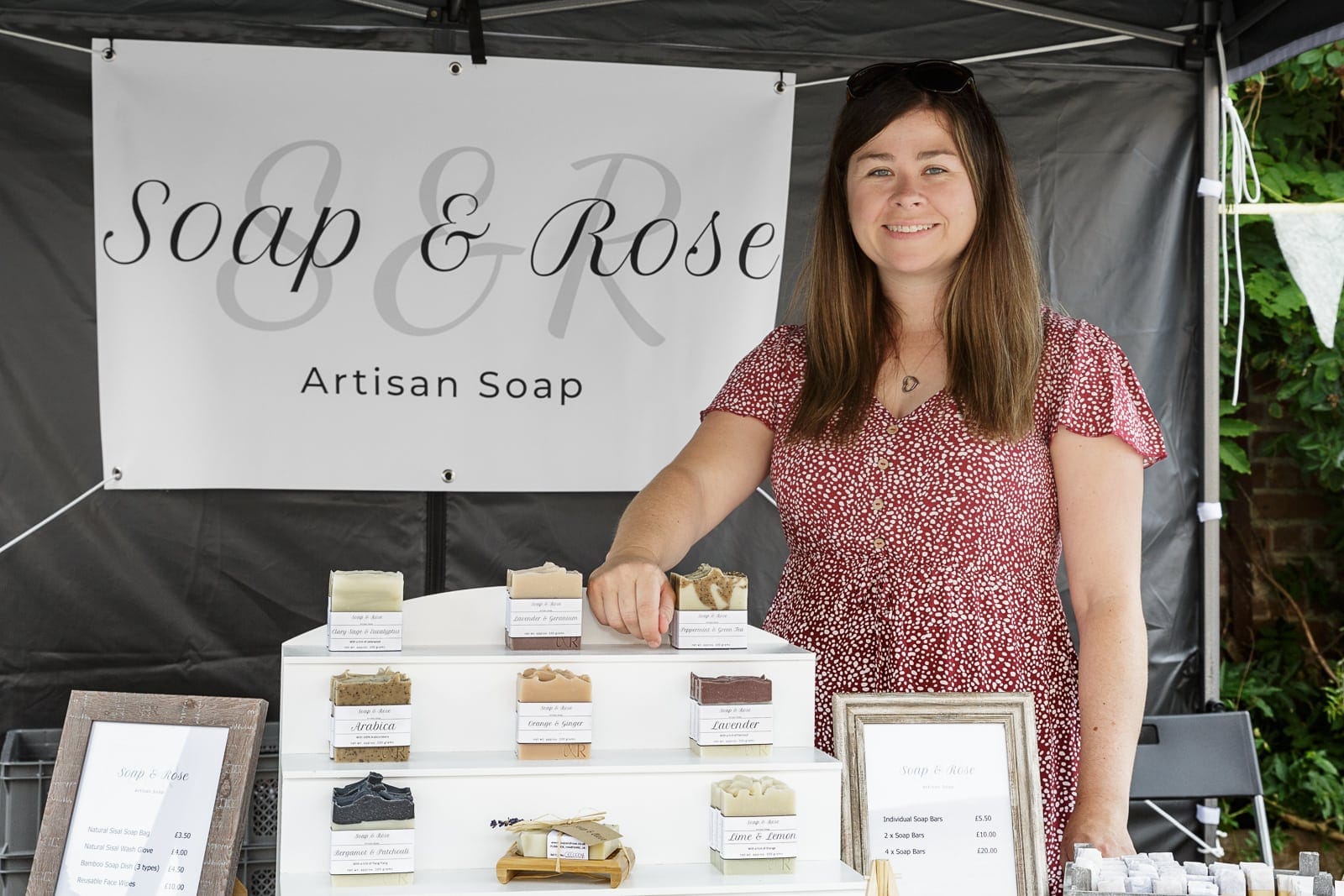 portrait of soap and rose co-owner, charlotte at a local craft fair