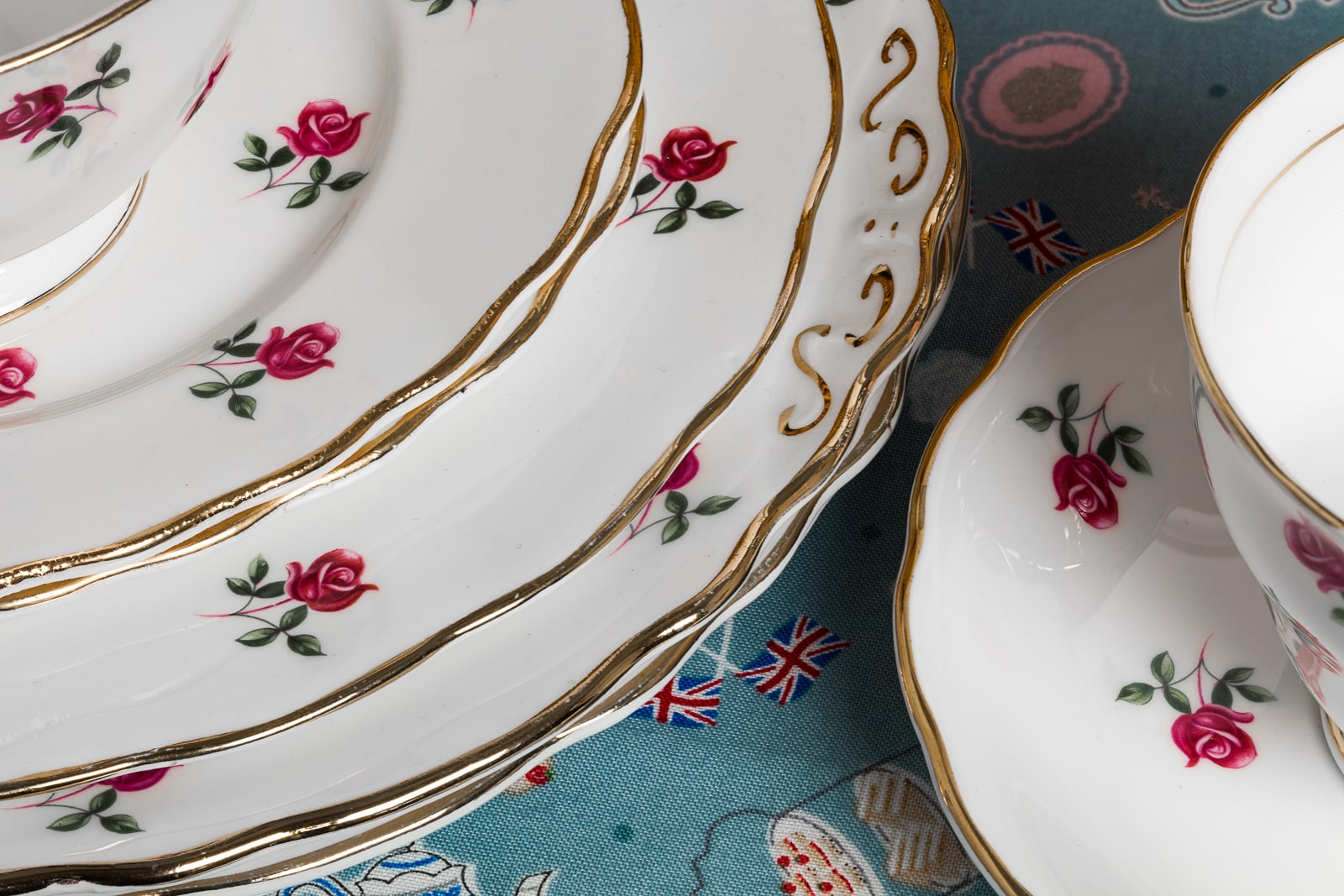 close up of vintage bone china tea set showing details of the small roses and gold finish edging