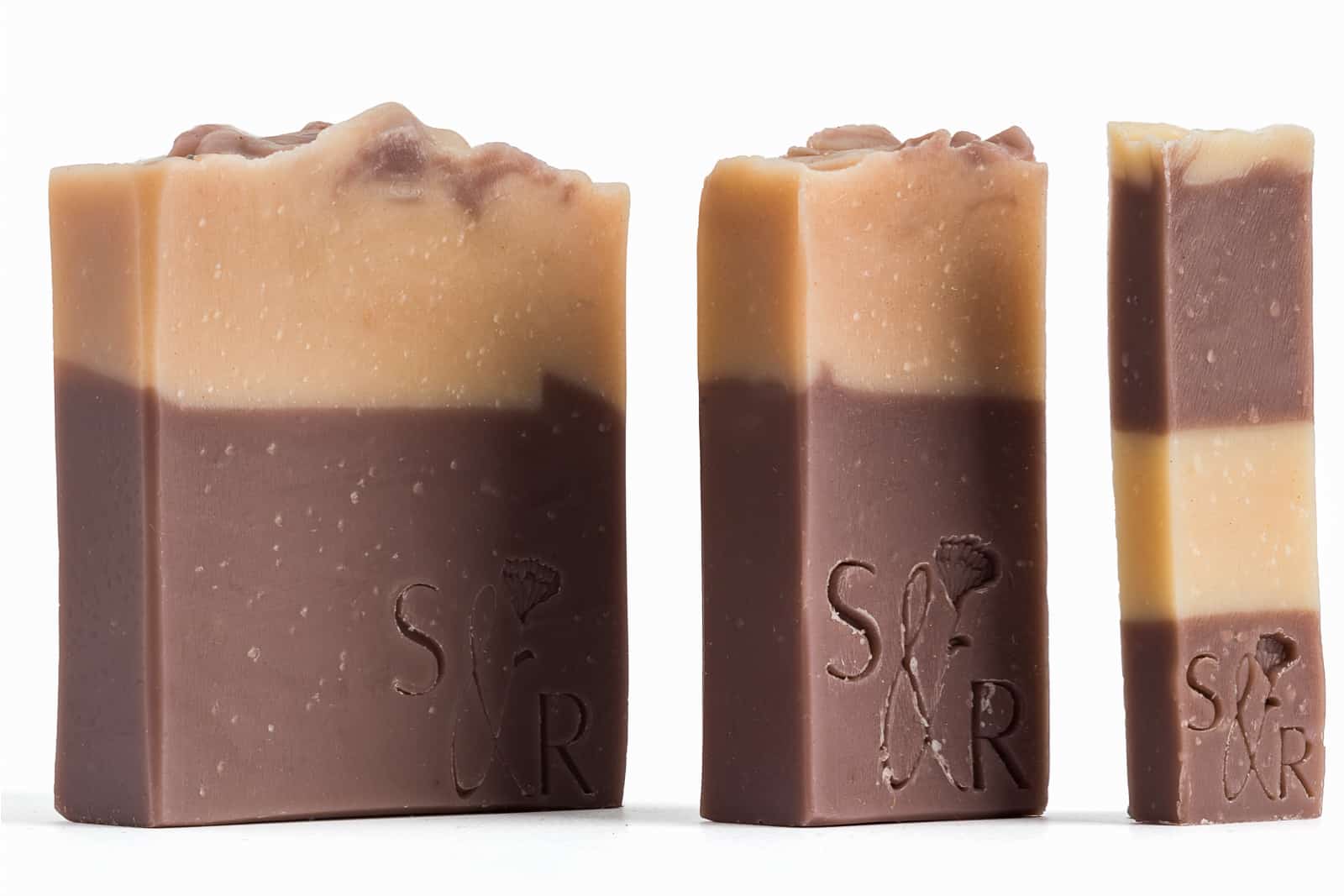 three different sizes of handmade soaps