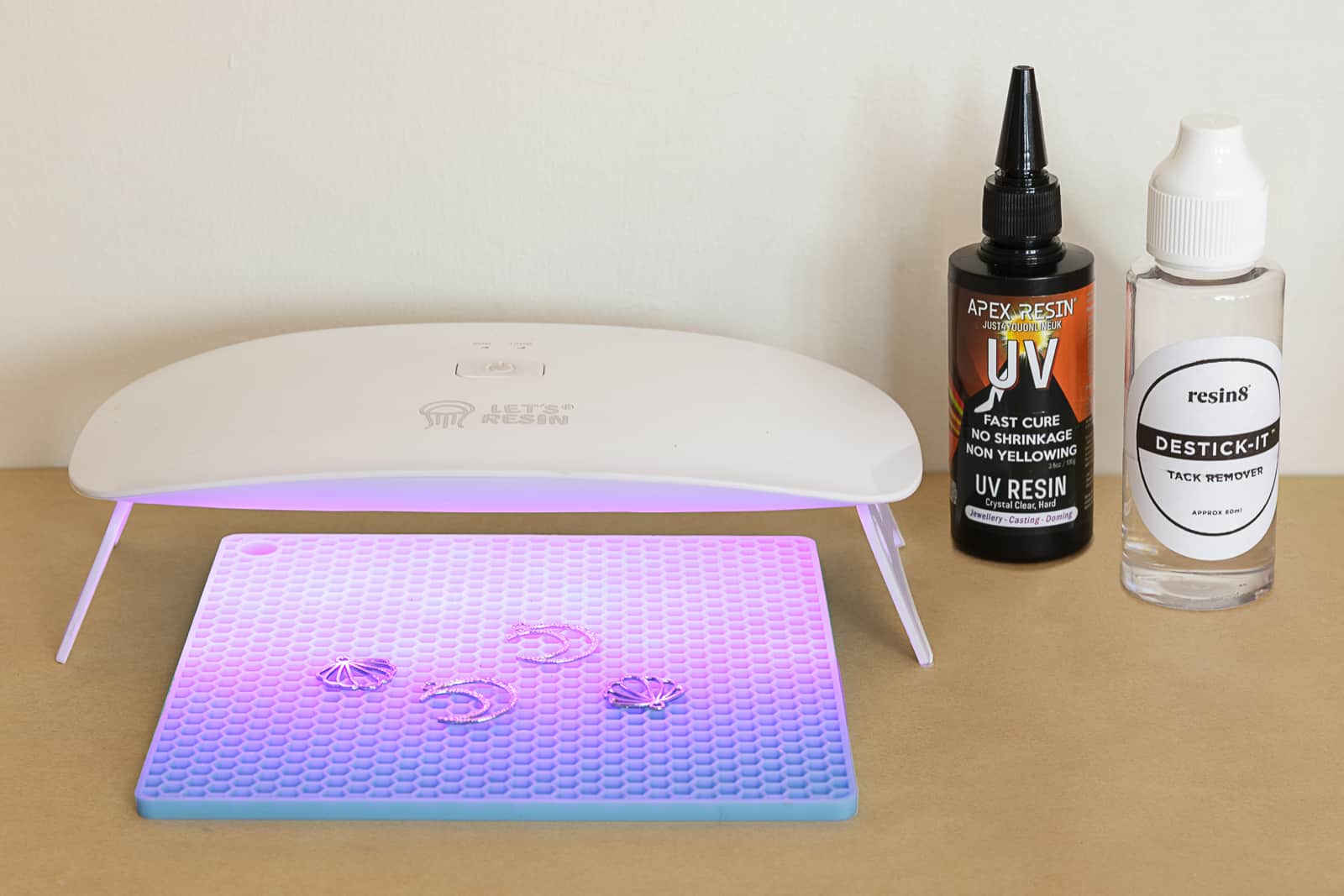 ultraviolet lamp curing resin encased natural products for earrings made by petal and plume