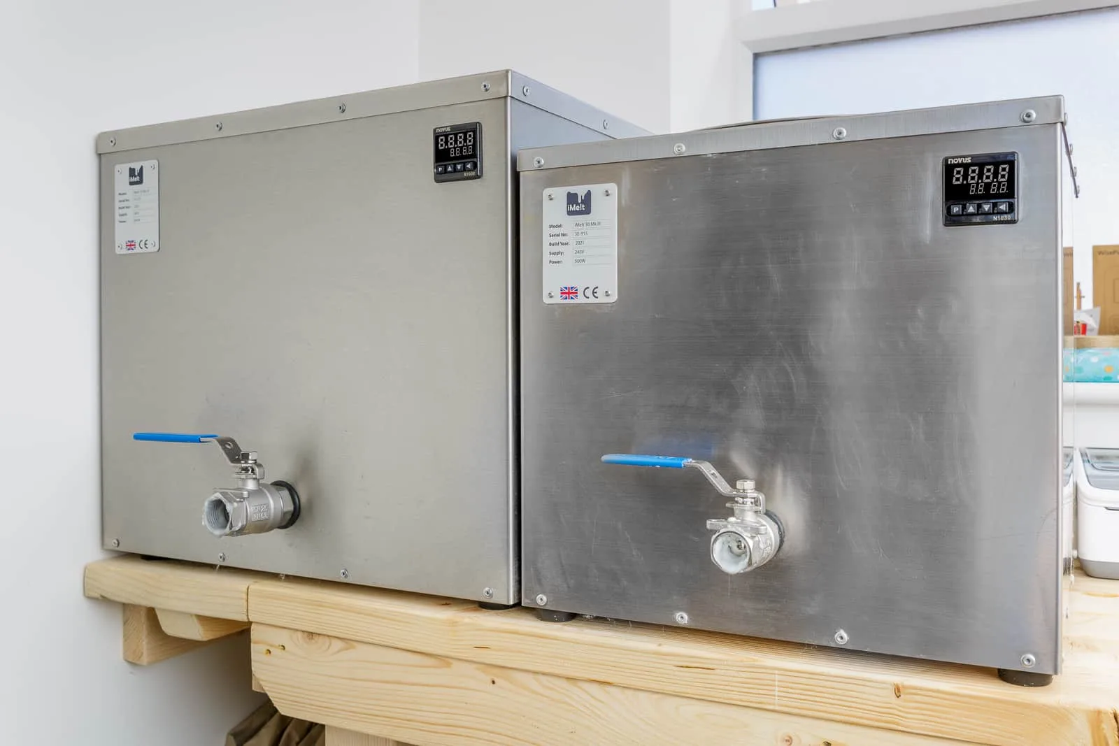 waximus-prime-and-melton-john two wax melting machines side by side for size comparison