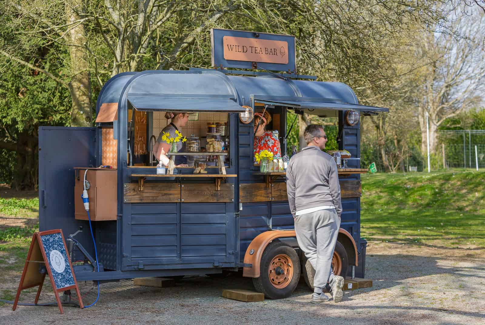 the wild tea bar horsebox with customer waiting to be served